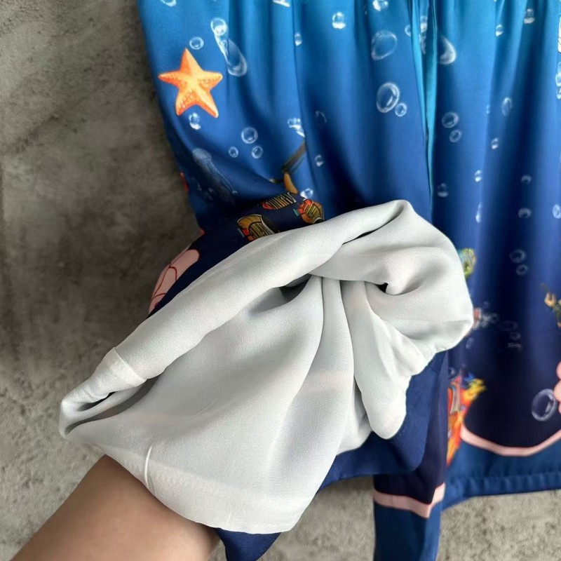 CASABLANCA Blue silk shorts with marine animal print