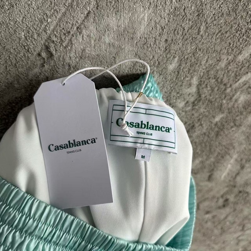 CASABLANCA Light blue silk shorts with ripple pattern