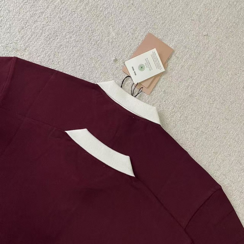 M*um*u red polo shirt