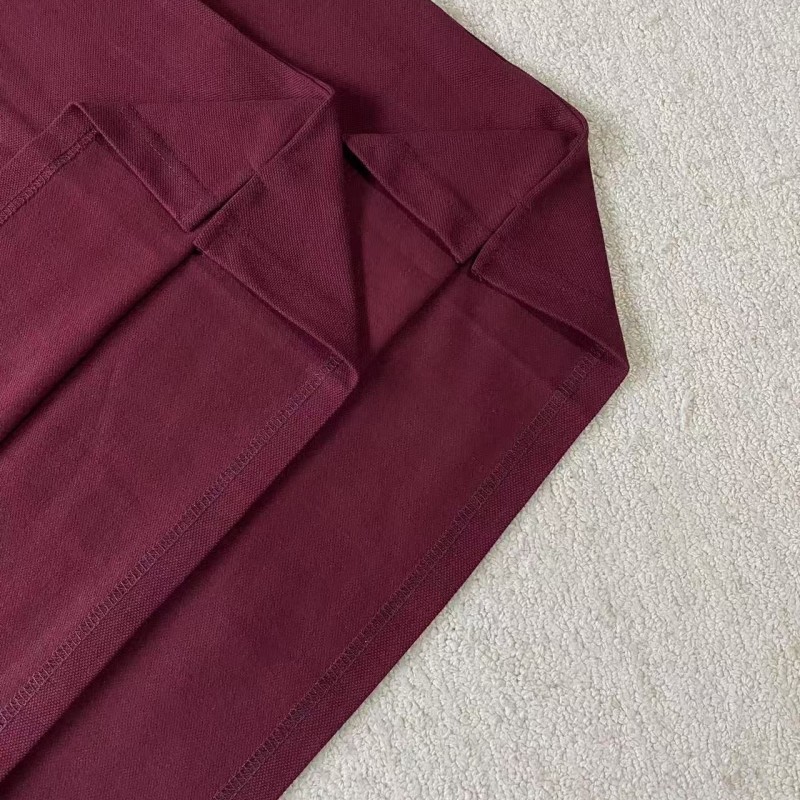 M*um*u red polo shirt