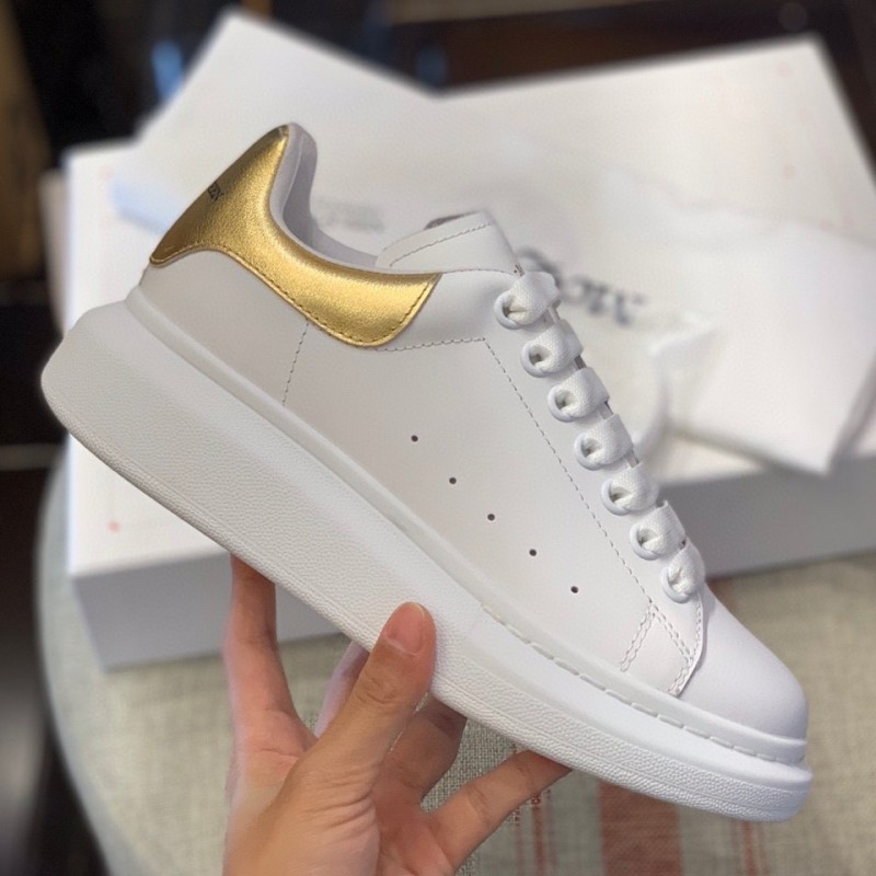 Ale*d*r M*Q*en MQ Gold cowhide tail Sneakers