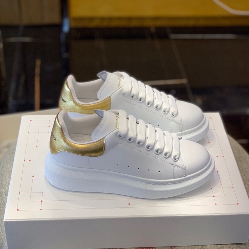 Ale*d*r M*Q*en MQ Gold cowhide tail Sneakers