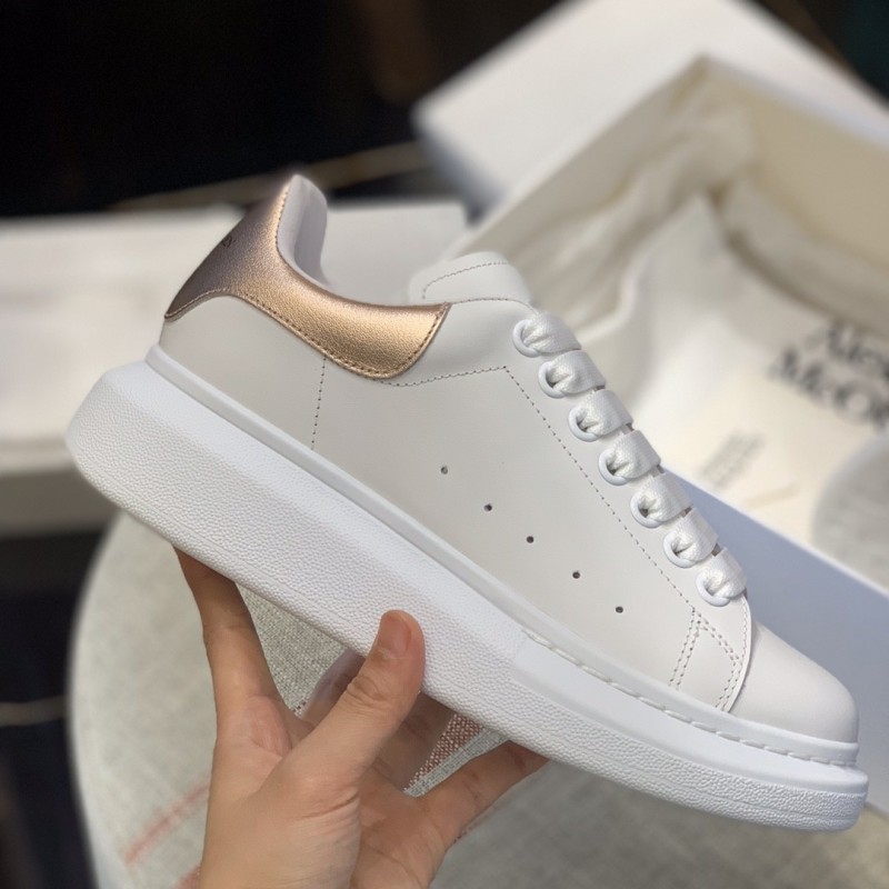 Ale*d*r M*Q*en MQ rose gold tail Sneakers