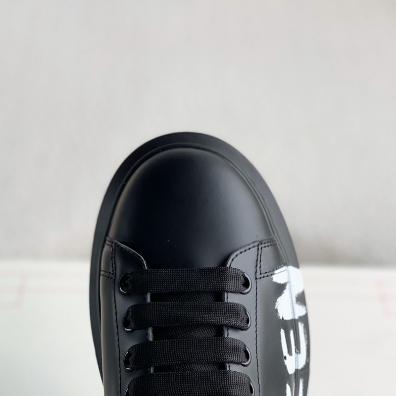 Ale*d*r M*Q*en black letter Sneakers