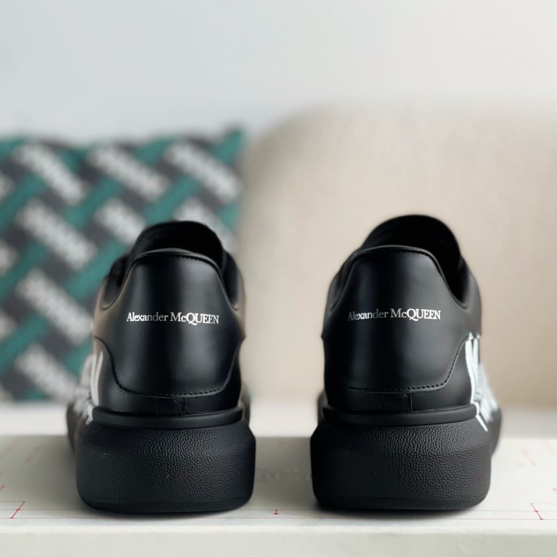 Ale*d*r M*Q*en black letter Sneakers