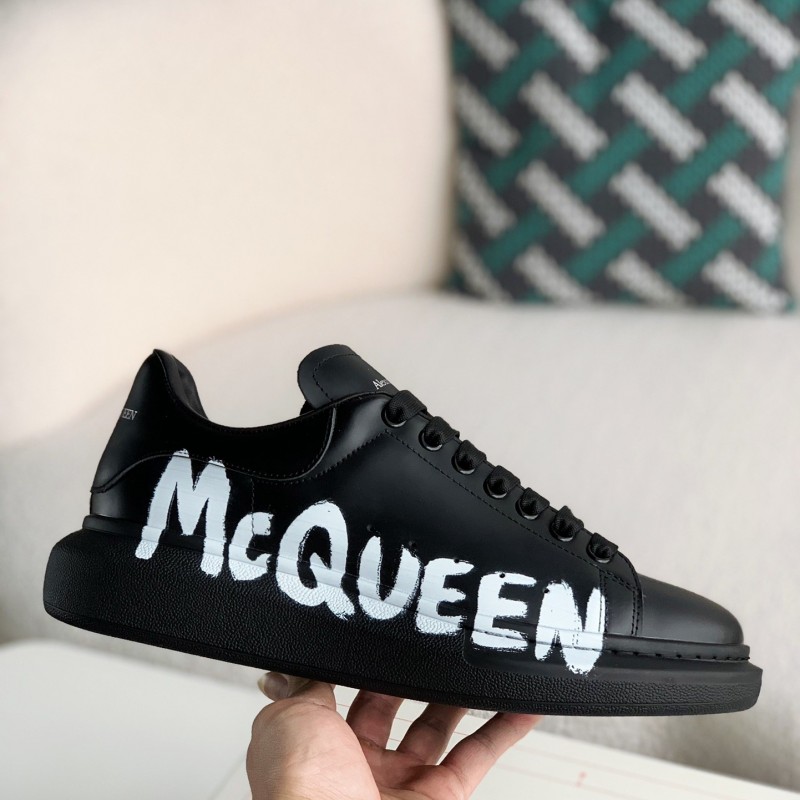 Ale*d*r M*Q*en black letter Sneakers