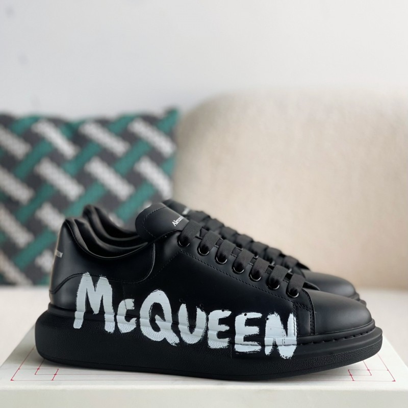 Ale*d*r M*Q*en black letter Sneakers