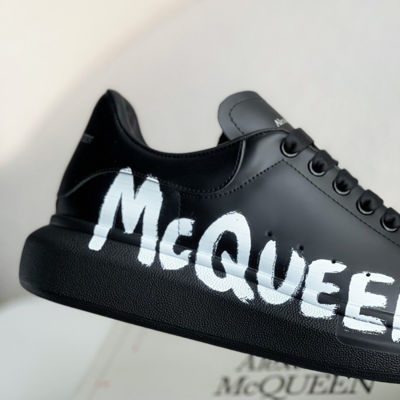 Ale*d*r M*Q*en black letter Sneakers