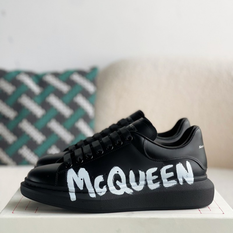 Ale*d*r M*Q*en black letter Sneakers