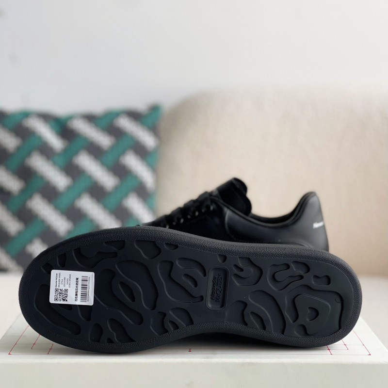 Ale*d*r M*Q*en black letter Sneakers